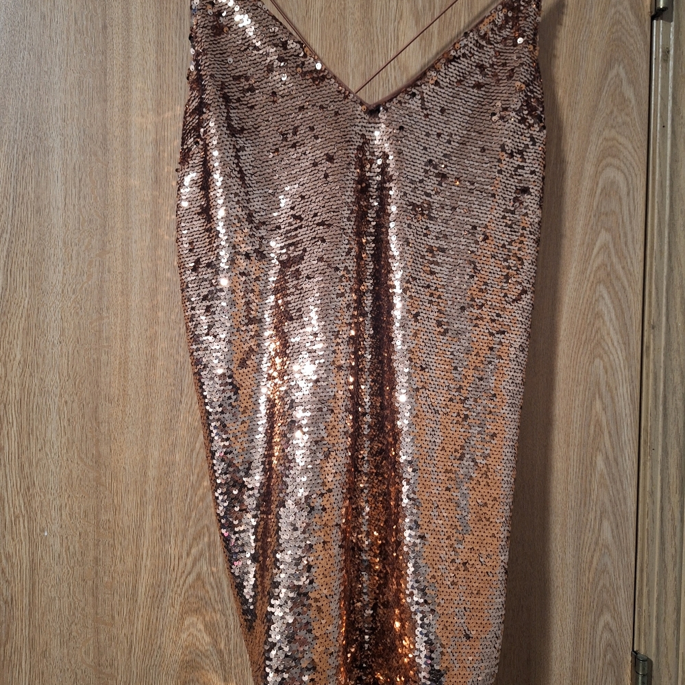Gold sleeveless slip dress with spaghetti straps and v-neck for cocktail